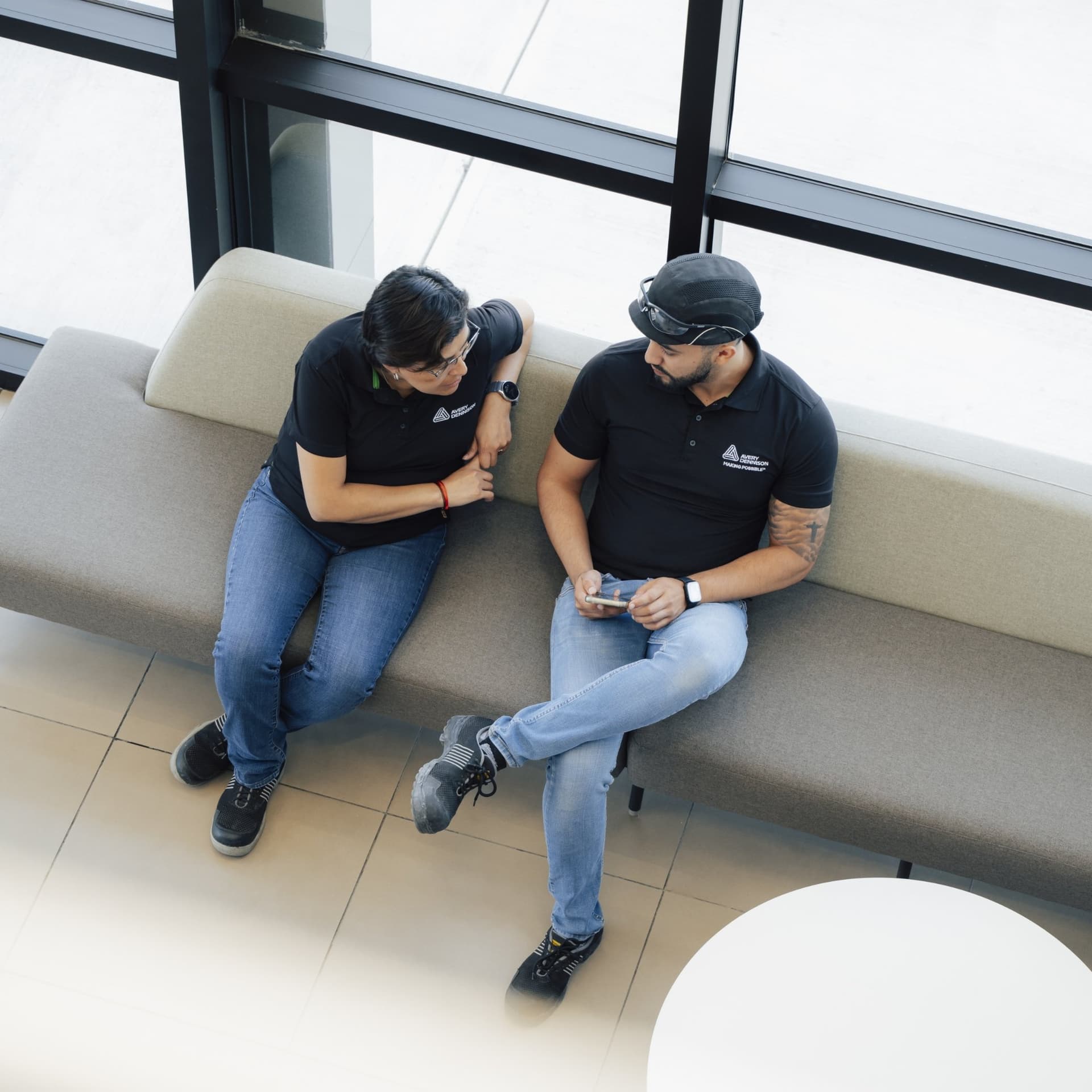 ad-lpm-cpg-arial-view-two-people-talking-office-environment-thumbnail
