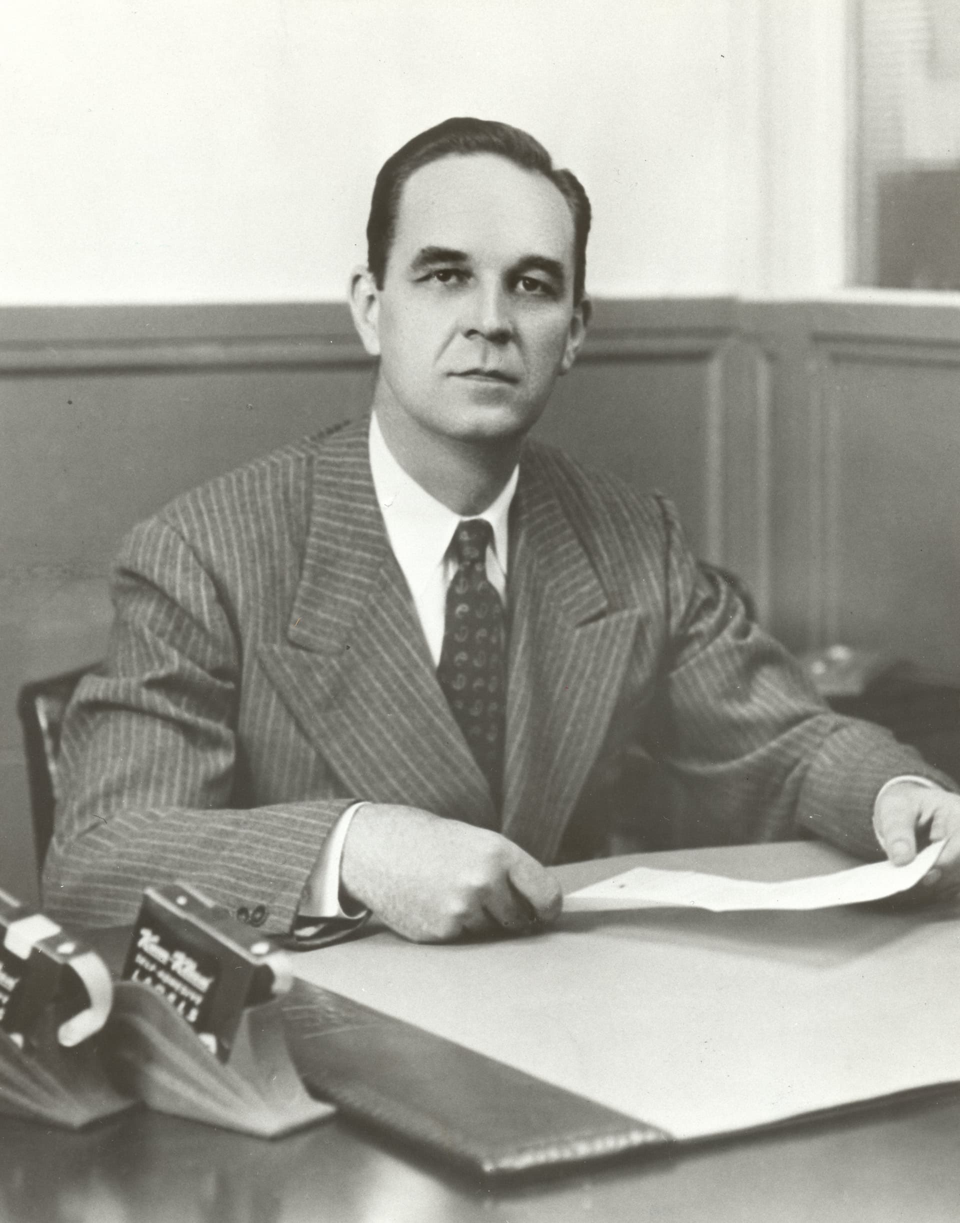 ad-lpm-cpg-stan-avery-sitting-at-desk-archival
