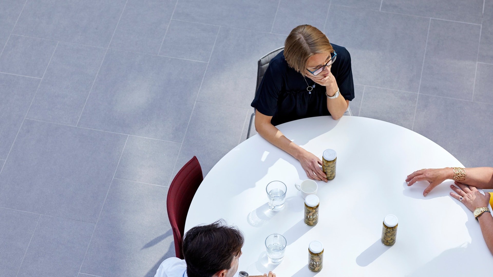 ad-lpm-cpg-aerial-experts-reviewing-products-at-table