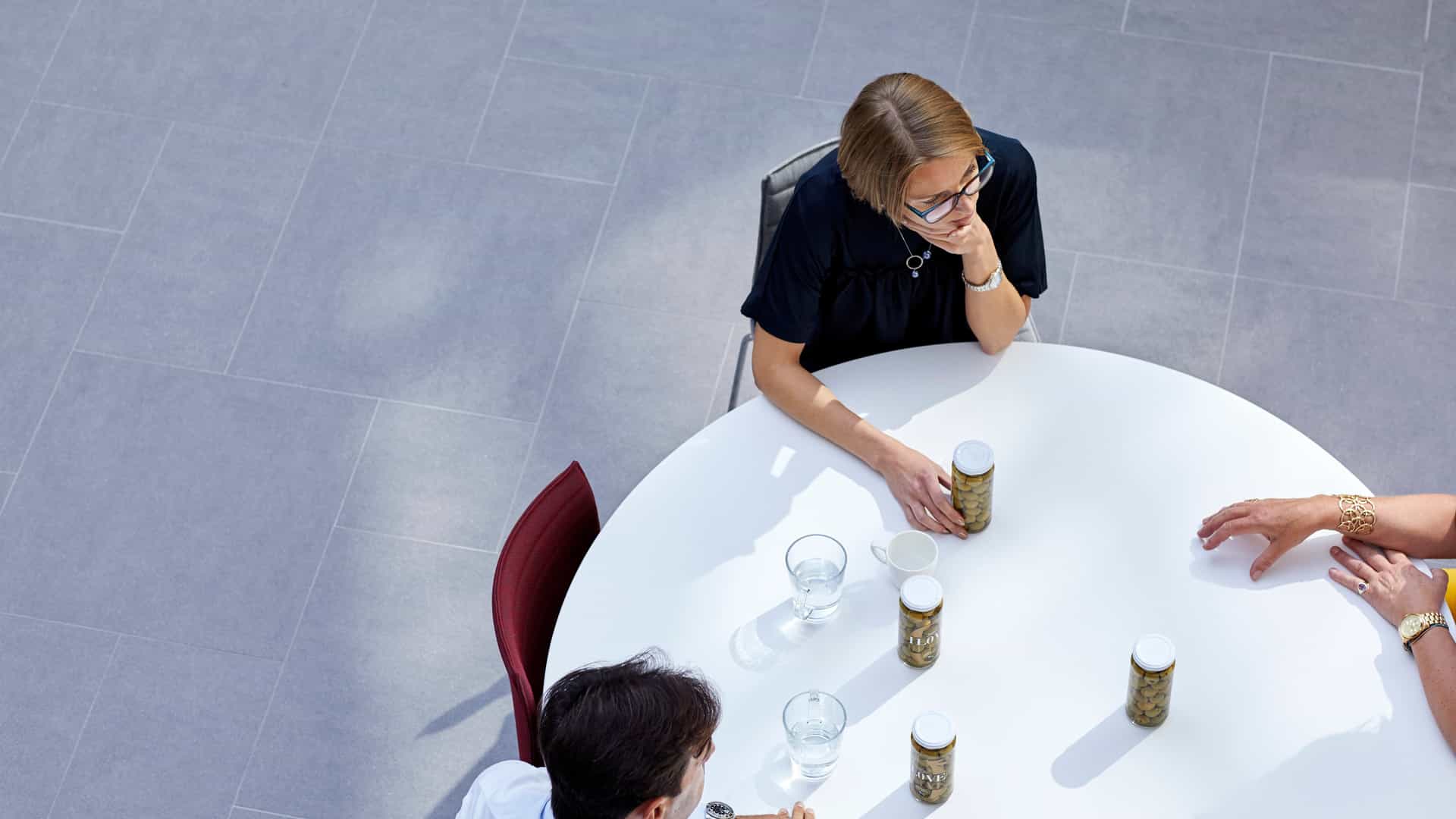 ad-lpm-cpg-aerial-experts-reviewing-products-at-table