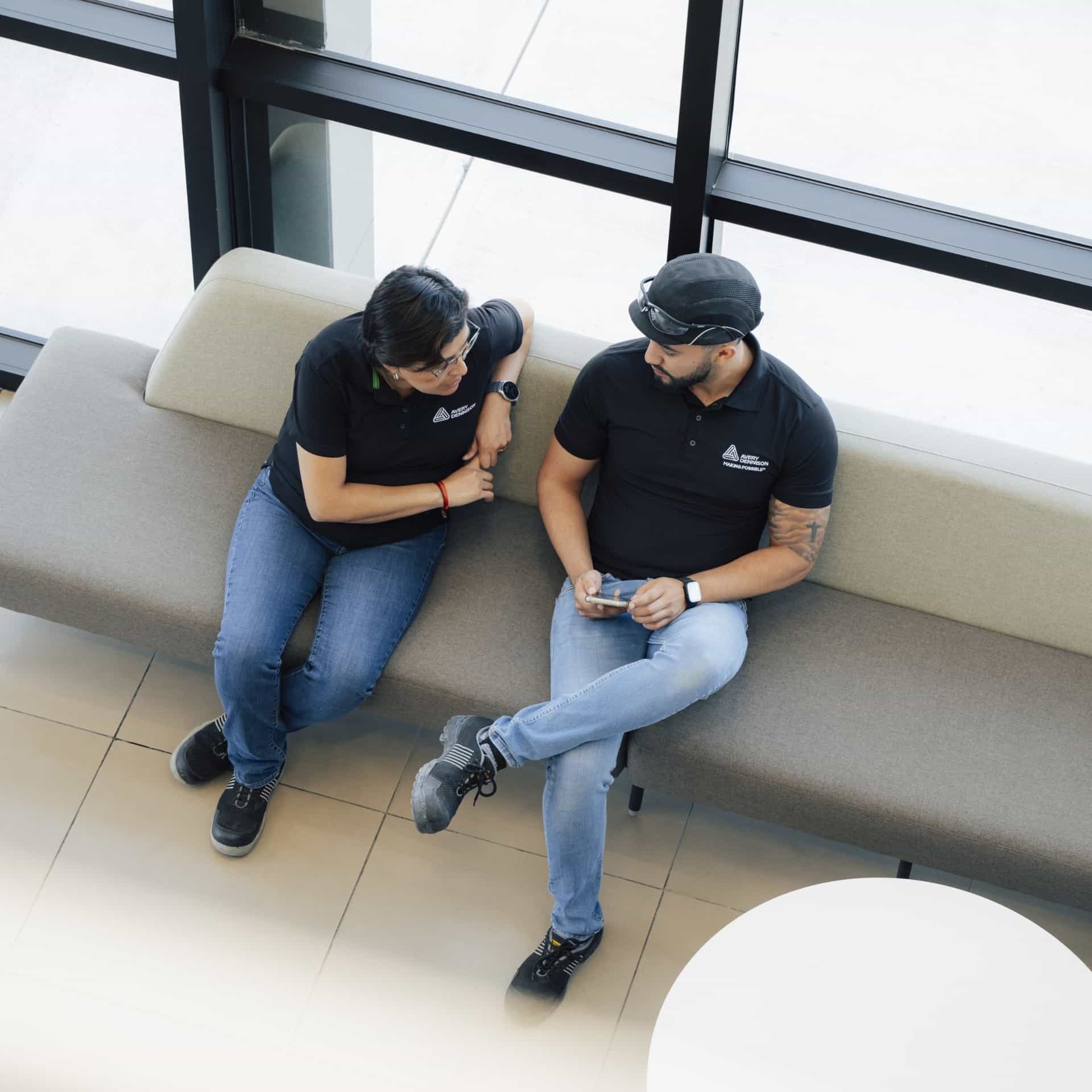 ad-lpm-cpg-arial-view-two-people-talking-office-environment-thumbnail
