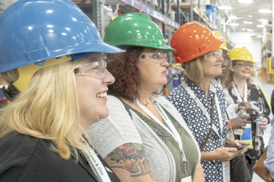 Visitors gather at Avery Dennison manufacturing plant.