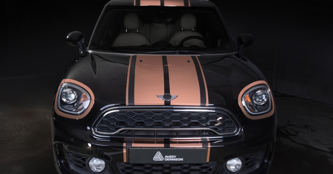 Sports car with vinyl racing stripes.