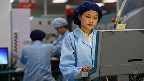 Factory operator looking at screen